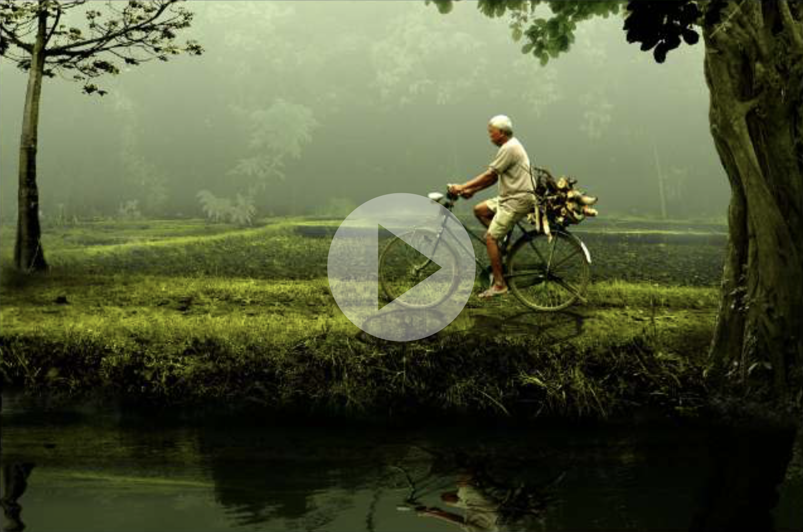 A man riding an old bike